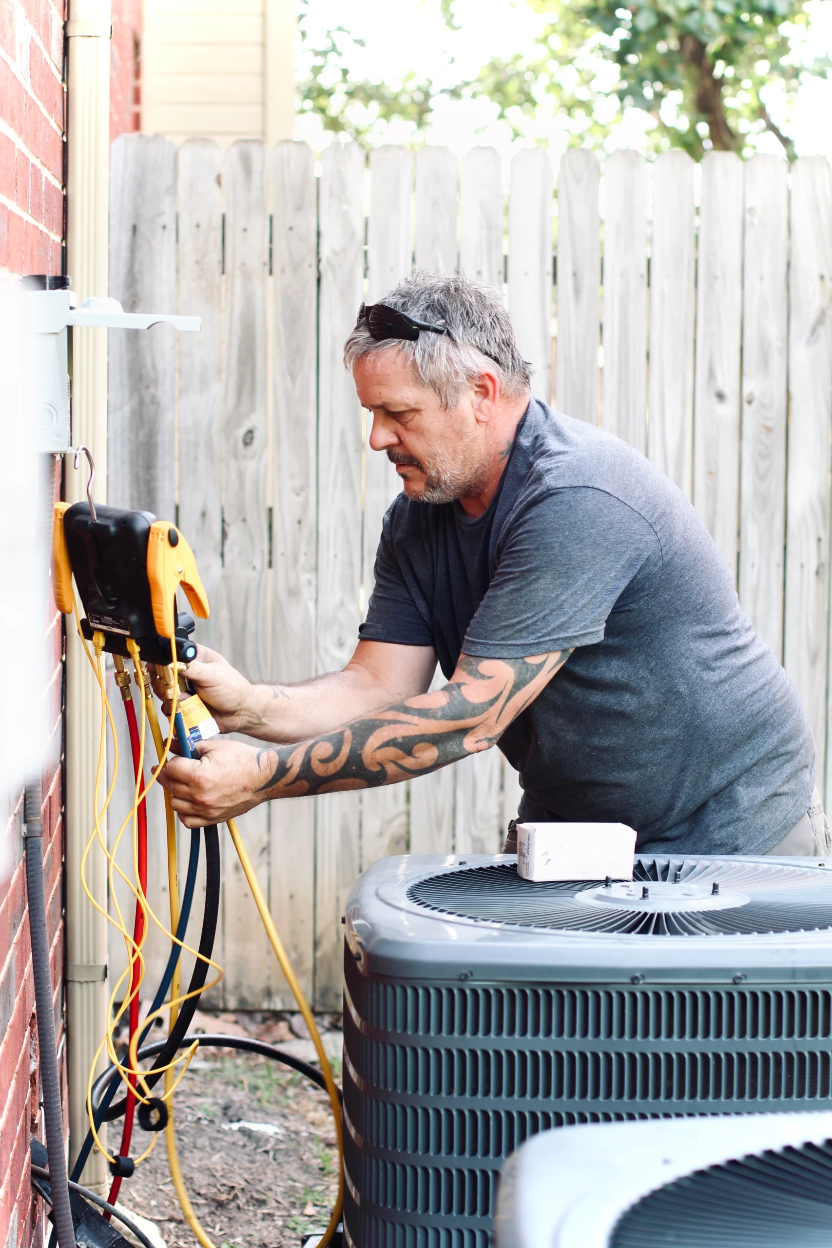 Austin AC repair tech working on HVAC system